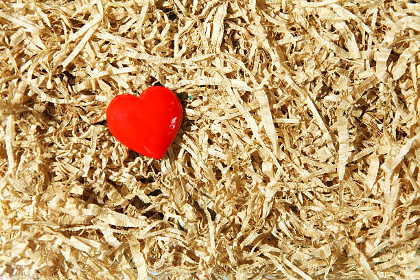 red heart on wood wool