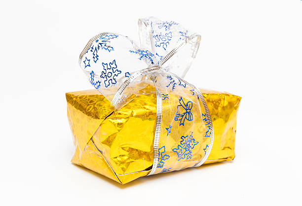 istock gold box with bow  on white background closeup 532687873