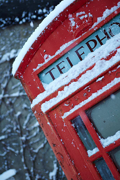 Snow covered trees and gas pump in Banff in the Canadian Rockies during the winter.