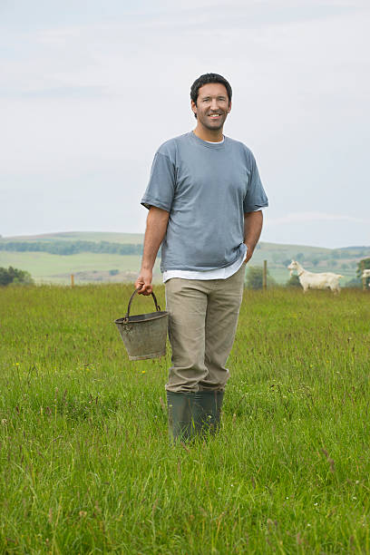 istock Man With Bucket In Field 532700381