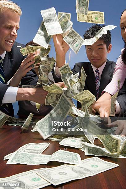 Businesspeople Throwing Money Stock Photo - Download Image Now - Anger, Businessman, Currency