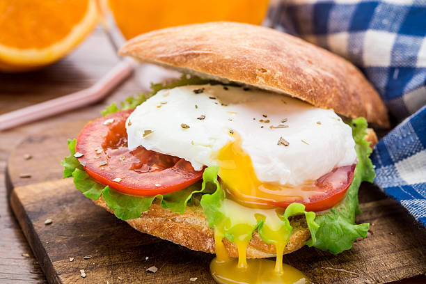 Burger with pouched egg and tomato