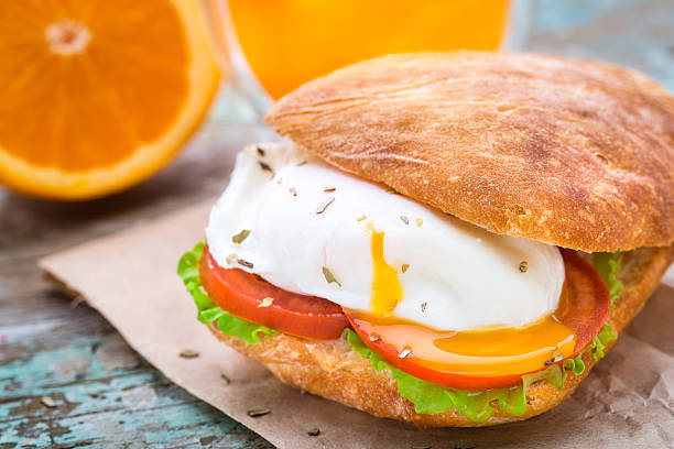 Burger with pouched egg and tomato