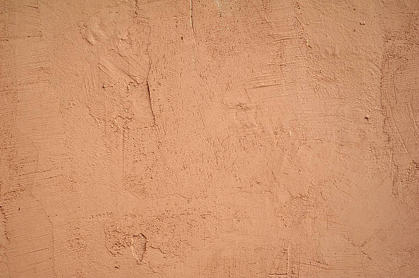 istock Texture of old wall covered with pink stucco 532701631