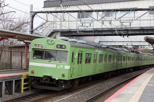 Kyoto, Japan - March 4, 2014 : Nara Line Train at the Inari Station in Kyoto, Japan. It is operated by the JR West.