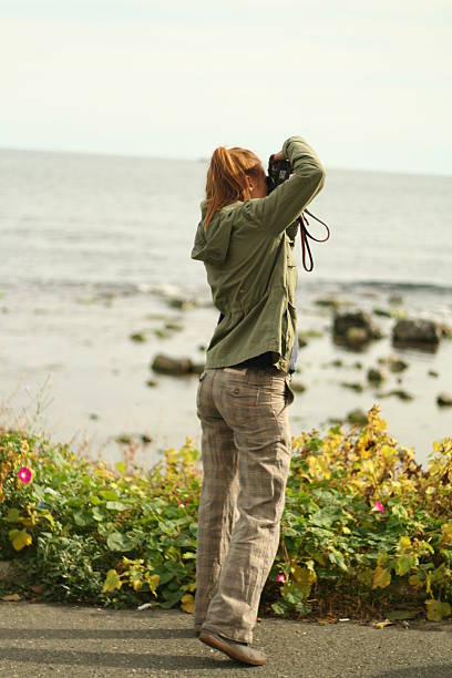 istock Girl is taking a photo 532702737