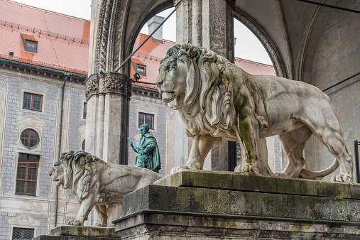 A stone lion sculpture at the Feldherrenhalle in Munich, Germany