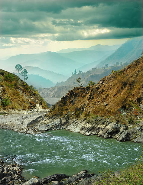 mountain river on the background of the misty mountain ranges of the Himalayas