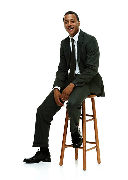 istock Cheerful businessman on stool & looking at camera 532705587
