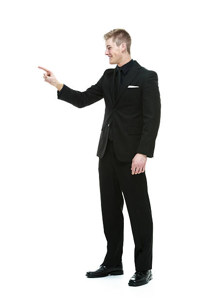 istock Smiling businessman pointing away 532705591