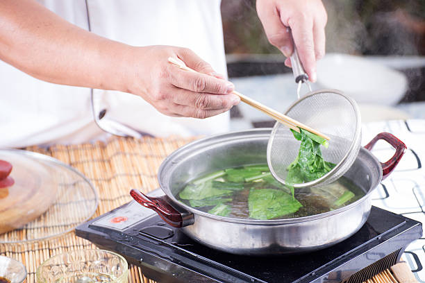 istock Chef scald vegetable in pot before cooking noodle 532705645