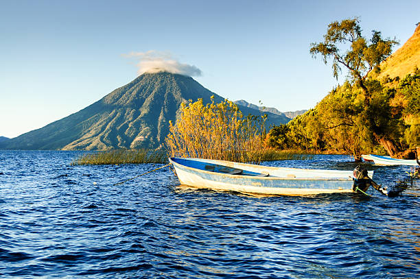 San Pedro Volcano on Lake Atitlan in Guatemalan highlands San Pedro Volcano (Volcan San Pedro) across Lake Atitlan (Lago de Atitlan) in Guatemalan highlands guatemala stock pictures, royalty-free photos & images