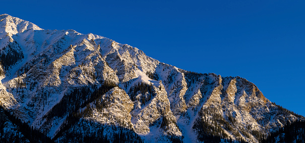 Tenmile Range Mountains in Winter at Sunset - Landscape scenic with fresh snow and rugged mountain terrain.  Stitched panorama.  Colorado, USA.