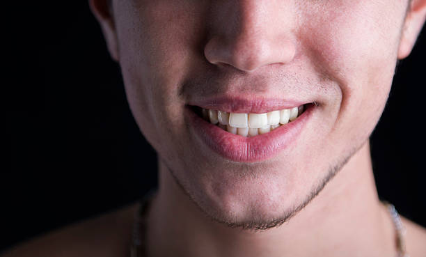 istock White teeth of a smiling young man 532729003