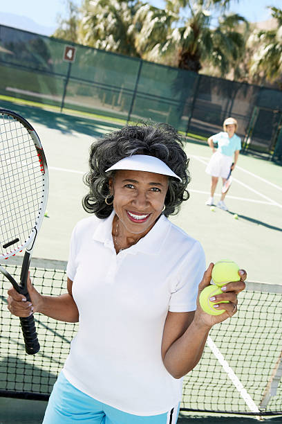 istock Smiling Woman Perparing to Serve 532729333