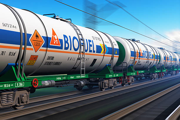 Freight train with biofuel tankcars Creative abstract fuel, oil and gas industry, ecology protection technology, logistics, cargo shipping and freight railroad transportation business concept: fast train with tankcars with biofuel with motion blur effect biofuel photos stock pictures, royalty-free photos & images