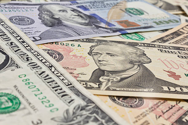 istock Close up of several dollar bills chaotically aligned 532747651