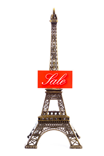 Paris, France, or European tour package on sale. Eiffel tower with sale sign on white background.