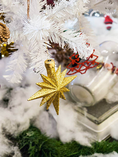 istock Christmas star on white christmas tree, soft focus, blur backgro 532749273