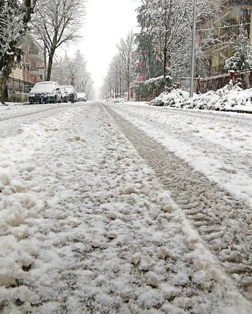 istock snow-covered city street during a winter snowfall 532749439