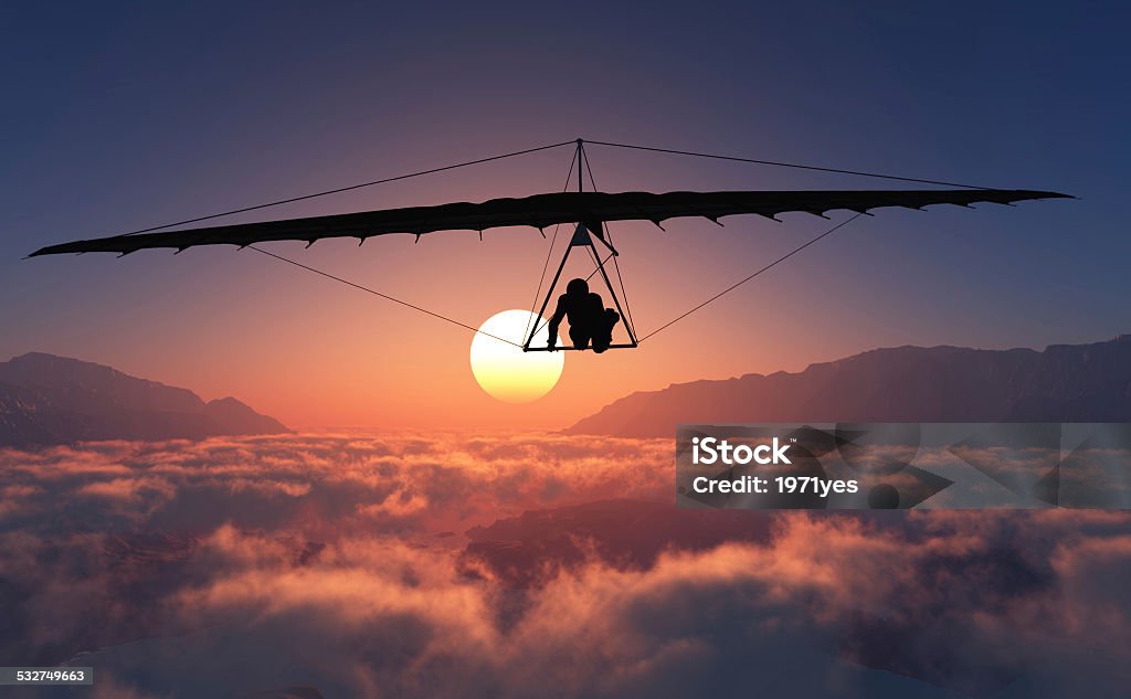 Sports radical Sports radical against on sunset background Hang-gliding Stock Photo