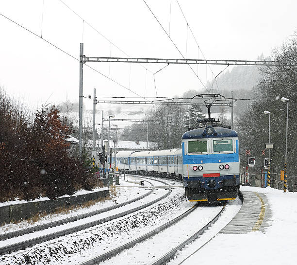 istock Czech train station at winter with train in a snowstorm 532749737