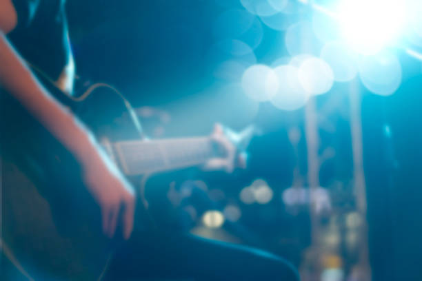 Guitarist on stage for background, soft and blur concept