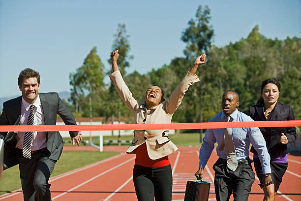 istock Businesswoman Cheering With Competitors Running 532750963