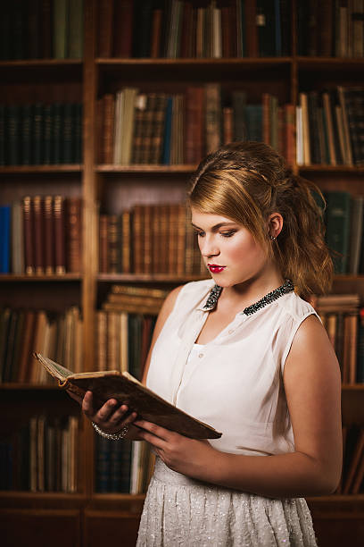 istock Beautiful young woman in library 532752085