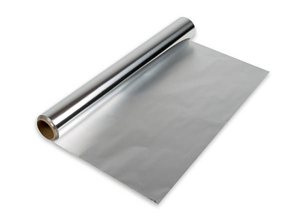 rollo de la lámina de aluminio - rolled up foil paper gray fotografías e imágenes de stock