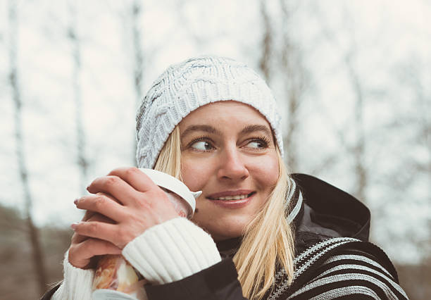 istock Smiling fashionable blonde drinking coffee outdoors. Toned 532769703