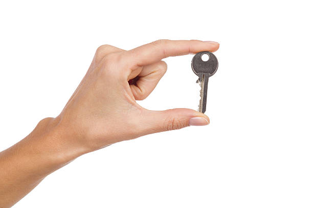 istock Woman hand's holding a key. 532769771