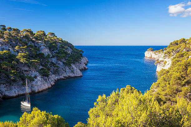 Sun-drenched Mediterranean coast with panoramic view of the turquoise blue bay of the city of Cassis, the Mediterranean port city and holiday paradise by the sea - Provence Alpes Côte d'Azur, France
