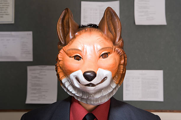 Office worker wearing a mask Office worker wearing a mask mask disguise stock pictures, royalty-free photos & images