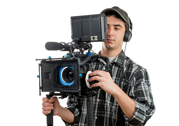 istock young cameraman with professionnal movie camera 532770567