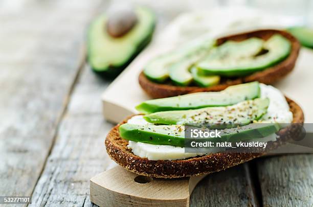 Sandwich Of Rye Bread With Avocado And Goat Cheese Stock Photo - Download Image Now - 2015, Avocado, Bread