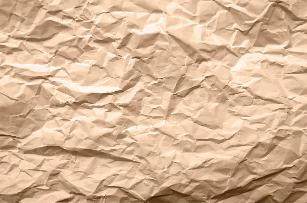 Light Brown Texture of Crumpled Paper Light Brown Texture of Crumpled Paper - Abstract Background crumpled paper stock illustrations
