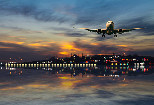 istock Airplane fly above the city 532773151