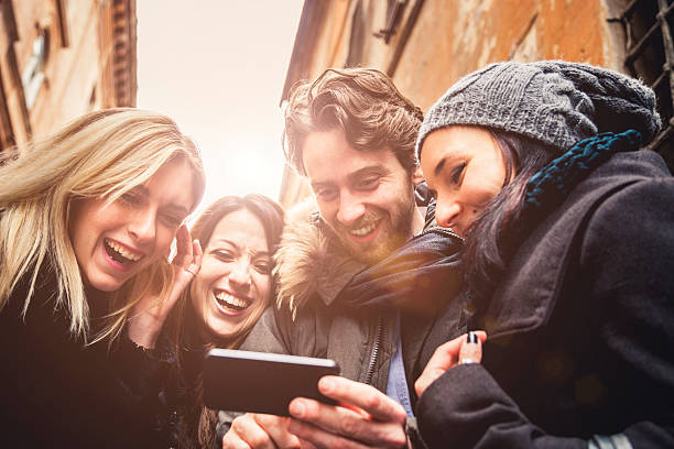 istock Group of happy friends doing conference call 532773899