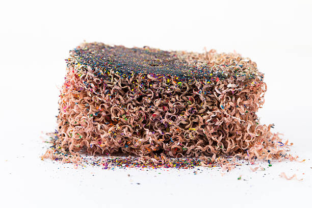 istock Wood chips from the pencil sharpener on white background. 532774043