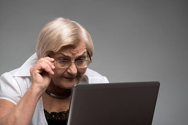 istock Elderly woman holding the laptop 532775437