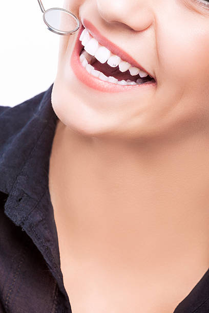 istock Examining Happy Female Patient's Teeth Using Mouth Dental Mirror 532775655