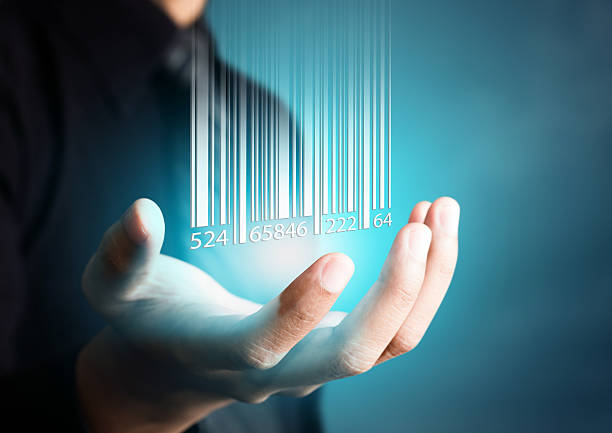 Barcode dropping on businessman hand Barcode dropping on businessman hand, financial concept bar code photos stock pictures, royalty-free photos & images
