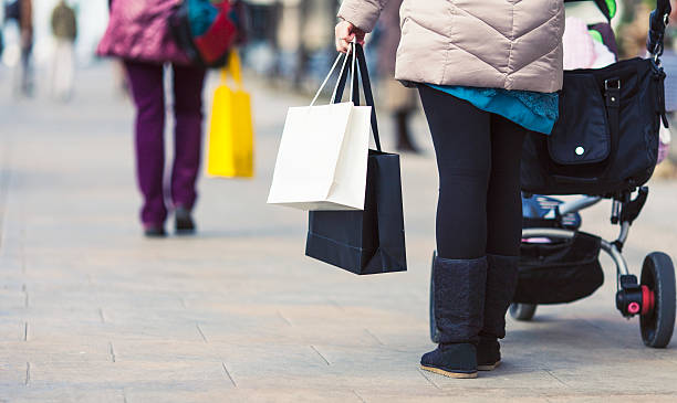 istock Mother with stroller shopping in the city 532785705