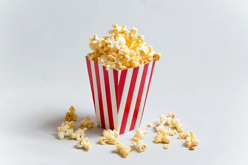 Popcorn in a bucket pattern on red background