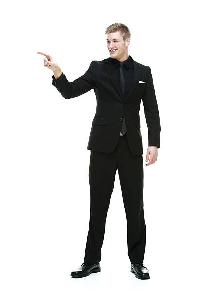 istock Smiling businessman pointing away 532786007