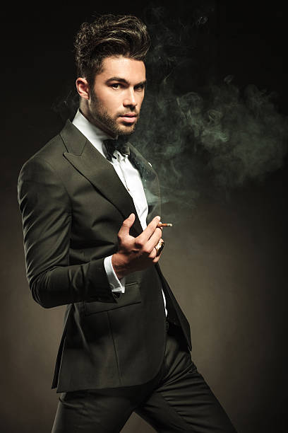istock Attractive business man cigartte in his hand, walking forward 532791327
