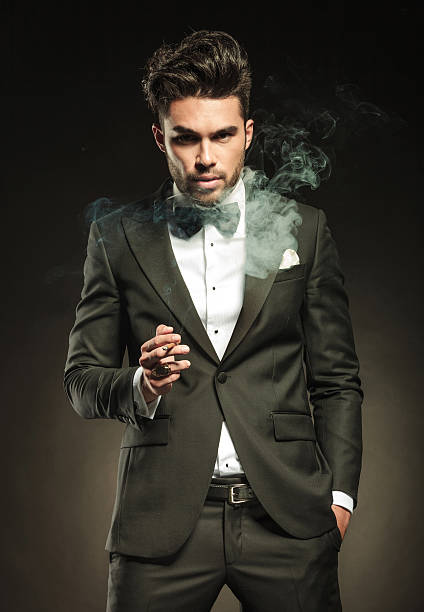 istock Elegant business man holding a cigarette in his right hand. 532791333