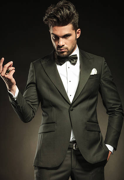 istock business man looking at the camera while snapping his fingers 532791837