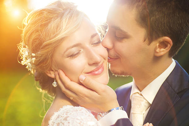 istock Young wedding couple on summer meadow 532811651